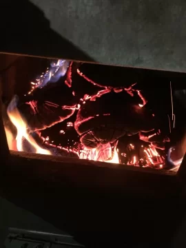 [Hearth.com] Kuuma Vapor Fire reload on small bed of coals