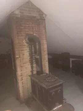 [Hearth.com] Stove in attic - vent with 90 into brick chimney, OR use Class A pipe straight through metal roof?