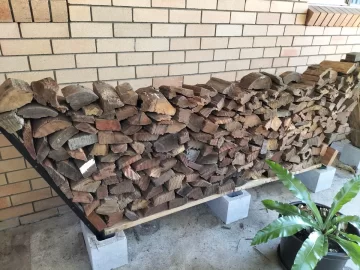 [Hearth.com] Diy firewood storage using bricks and fence pairings treated with arson