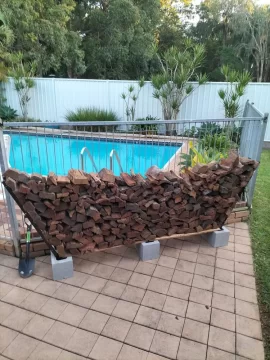 [Hearth.com] Diy firewood storage using bricks and fence pairings treated with arson