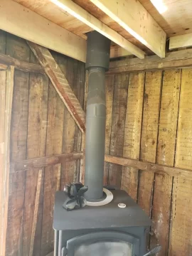 [Hearth.com] Boxing in around this wood stove chimney, second floor.  How far away does my framing need to be?