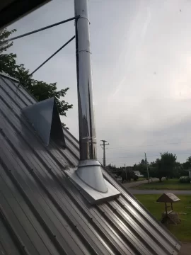 [Hearth.com] Boxing in around this wood stove chimney, second floor.  How far away does my framing need to be?