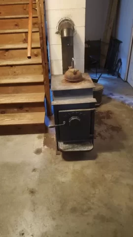 [Hearth.com] Fire blocking between a wood stove and a wooden stair case.