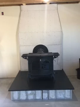 [Hearth.com] How to install stone around metal chimney duct?