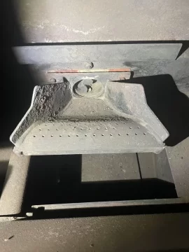 [Hearth.com] Cleaning up a Harman pellet stove burnpot with white aluminum oxide.