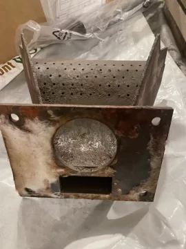 [Hearth.com] Cleaning up a Harman pellet stove burnpot with white aluminum oxide.