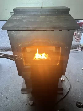 [Hearth.com] Cleaning up a Harman pellet stove burnpot with white aluminum oxide.