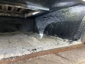 [Hearth.com] Oslo F500 ash pan door creosote. Anyone else have problems like this? Replaced gasket February last season hoping that was the problem.