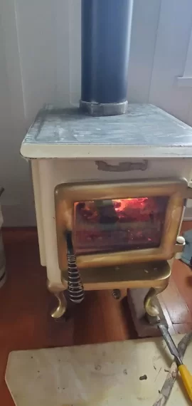 [Hearth.com] 1980s brass flame is this original?  Paint burn smell