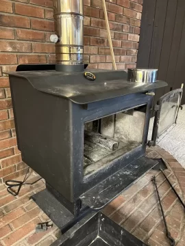 [Hearth.com] Century fw300xx has this pipe to a hole in the bottom of the fire box