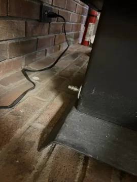 [Hearth.com] Century fw300xx has this pipe to a hole in the bottom of the fire box