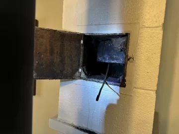 [Hearth.com] Chimney clean out not sealed.