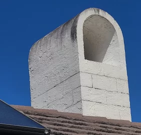 [Hearth.com] Chimney cinder blocks appearing through stucco