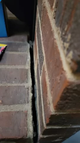 [Hearth.com] Brick hearth separating from main fireplace structure.