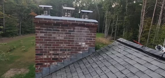 [Hearth.com] Chimney flue back drafting down the adjacent flue. Chimney extension?