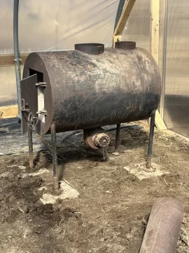 [Hearth.com] Barrel stove in a greenhouse