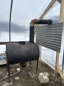 [Hearth.com] Barrel stove in a greenhouse