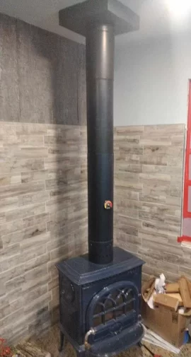 [Hearth.com] smoke coming out of the flue pipe as it goes into the ceiling box