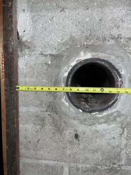 [Hearth.com] Liner, tee and wall pass through in masonry chimney.