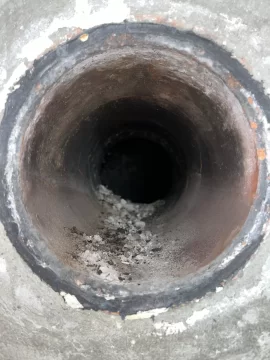 [Hearth.com] Liner, tee and wall pass through in masonry chimney.