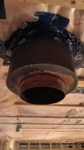 [Hearth.com] Is tuck tape and vapour barrier allowed to touch my chimney thimble?