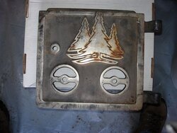 Can anyone identify this stove door ?