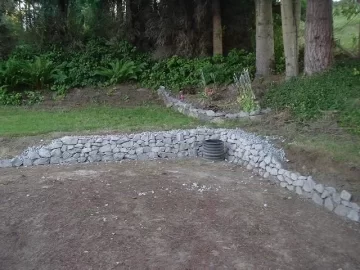 [Hearth.com] Practing stacking rocks for the hearth, walls.