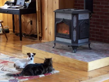 [Hearth.com] Your pup enjoying the stove or insert.