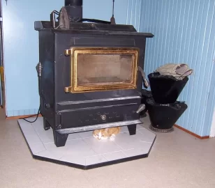 [Hearth.com] Your pup enjoying the stove or insert.