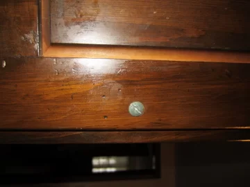 [Hearth.com] removing plate behind kitchen cabinet pull (estucheon plate?)